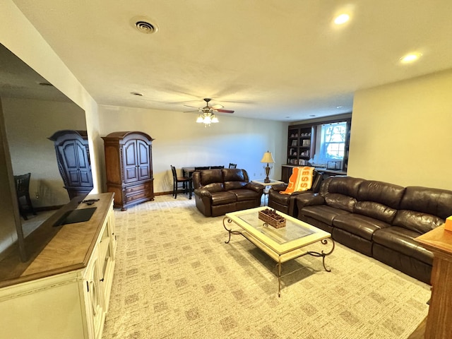 living room with light carpet and ceiling fan