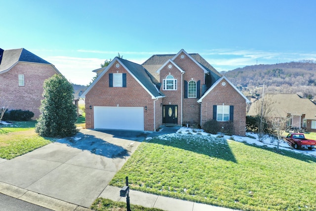 view of property featuring a garage and a front yard