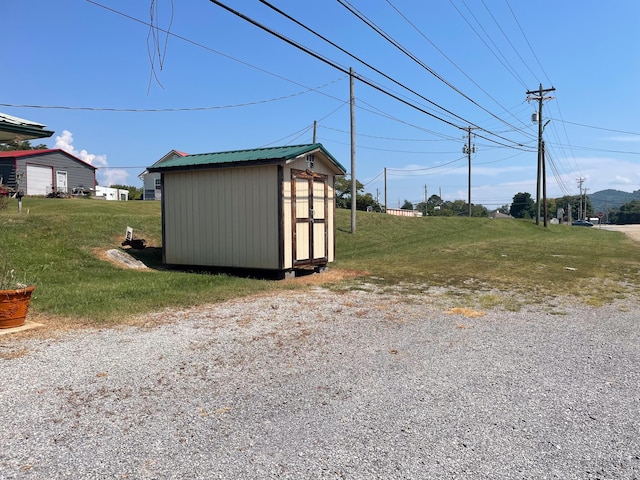 view of outdoor structure with a lawn