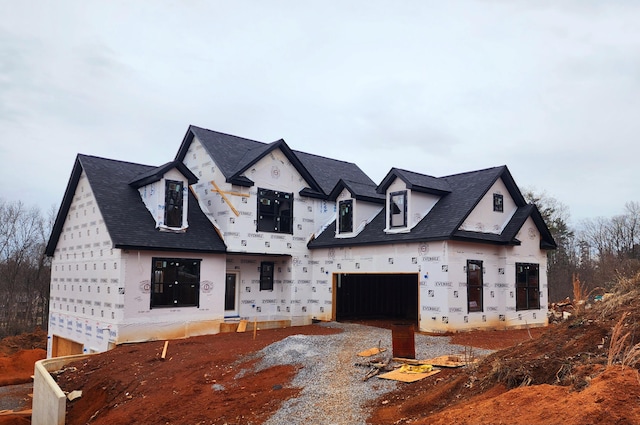 unfinished property featuring a garage