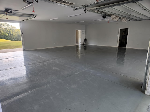 garage featuring baseboards and a garage door opener