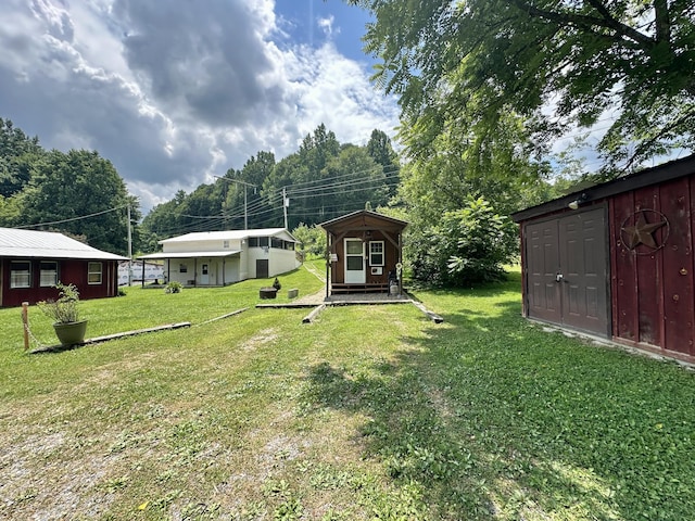 4140 Chavis Rd, Cosby, TN 37722 - view of grassy yard with a storage unit