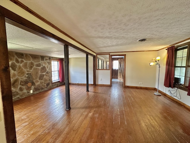 4140 Chavis Rd, Cosby, TN 37722 - unfurnished living room with wood-type flooring, ornamental molding, and a textured ceiling