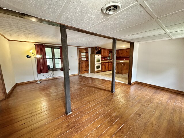 4140 Chavis Rd, Cosby, TN 37722 - unfurnished living room featuring wood-type flooring and baseboards