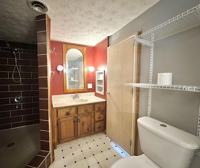 4140 Chavis Rd, Cosby, TN 37722 - bathroom with a stall shower, vanity, a textured ceiling, and tile patterned floors