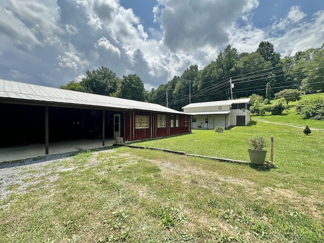 4140 Chavis Rd, Cosby, TN 37722 - view of green lawn with an attached carport