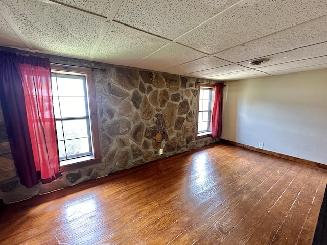 4140 Chavis Rd, Cosby, TN 37722 - unfurnished room featuring hardwood / wood-style flooring and a drop ceiling