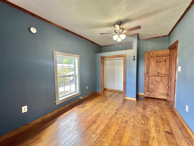 4140 Chavis Rd, Cosby, TN 37722 - unfurnished bedroom with crown molding, hardwood / wood-style floors, and ceiling fan