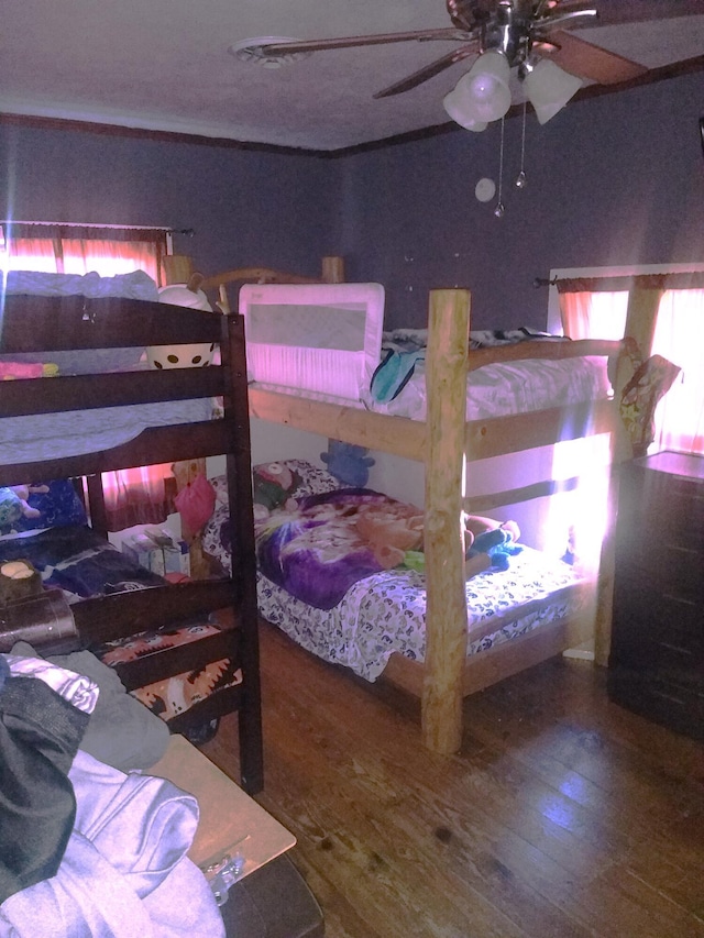 bedroom featuring ceiling fan and wood-type flooring