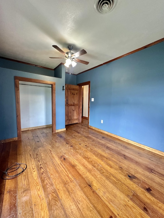 4140 Chavis Rd, Cosby, TN 37722 - unfurnished bedroom featuring wood finished floors, a closet, ceiling fan, and crown molding