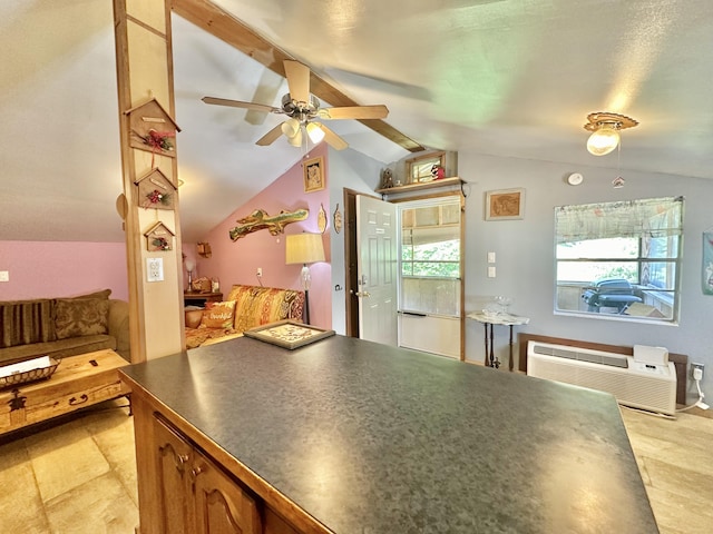 4140 Chavis Rd, Cosby, TN 37722 - kitchen featuring dark countertops, vaulted ceiling, ceiling fan, open floor plan, and brown cabinets
