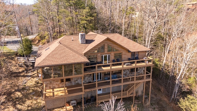 449 Lucerne Way, Gatlinburg, TN 37738 - rear view of house featuring a wooden deck, a view of trees, a chimney, and a shingled roof