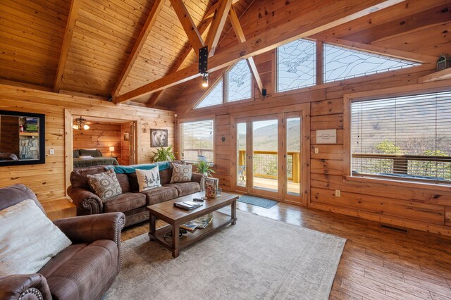 449 Lucerne Way, Gatlinburg, TN 37738 - living room featuring wooden walls, plenty of natural light, wood ceiling, and hardwood / wood-style floors