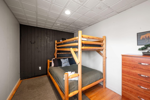 449 Lucerne Way, Gatlinburg, TN 37738 - bedroom with wood finished floors, baseboards, and wood walls