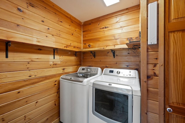 449 Lucerne Way, Gatlinburg, TN 37738 - clothes washing area with laundry area, wooden walls, and separate washer and dryer