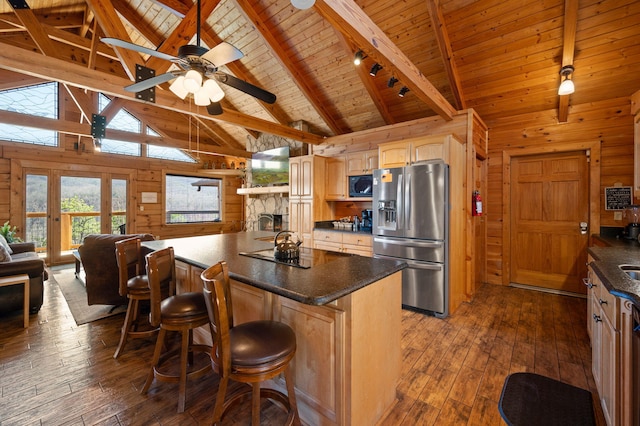 449 Lucerne Way, Gatlinburg, TN 37738 - kitchen featuring dark countertops, black appliances, wood walls, and dark wood-style flooring