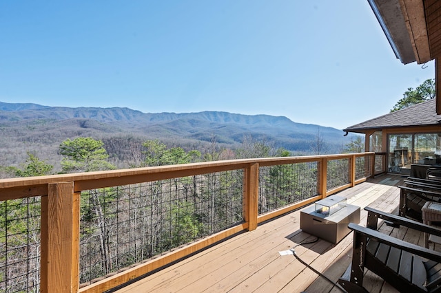 449 Lucerne Way, Gatlinburg, TN 37738 - wooden deck with a mountain view and a fire pit