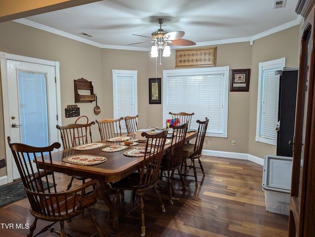 dining space with ceiling fan, ornamental molding, and dark wood-type flooring