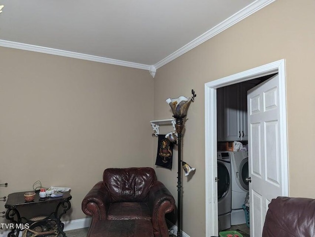 living area with washer and clothes dryer and ornamental molding