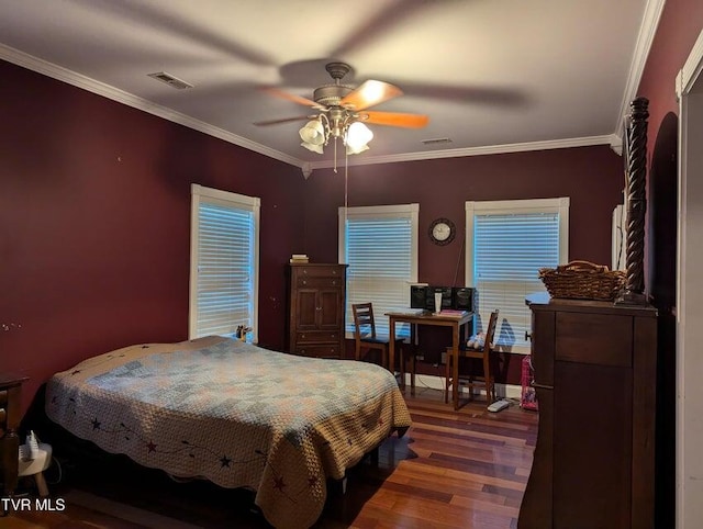 bedroom with hardwood / wood-style floors, ceiling fan, and crown molding