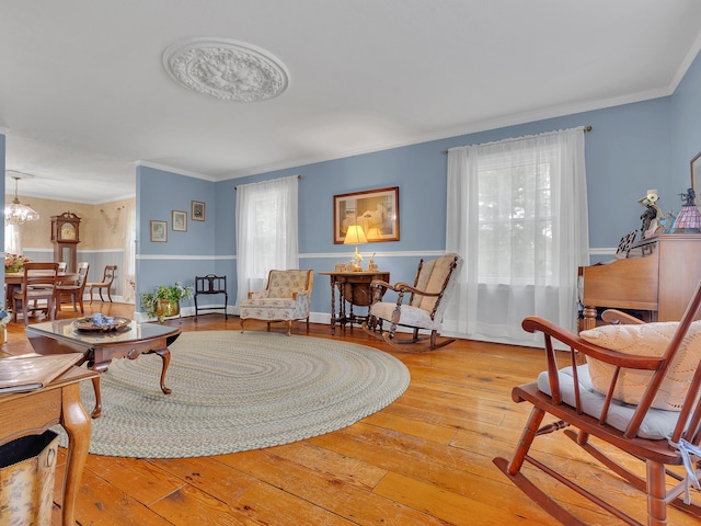 6525 Idumea Rd, Corryton, TN 37721 - living area with hardwood / wood-style floors, crown molding, and a chandelier