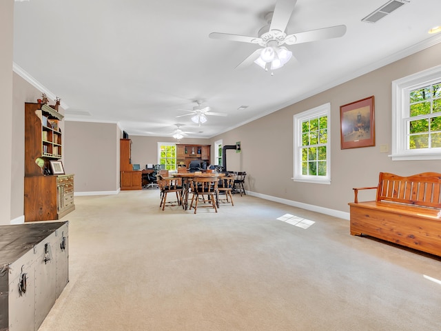 6525 Idumea Rd, Corryton, TN 37721 - dining room with baseboards, light carpet, ornamental molding, ceiling fan, and plenty of natural light