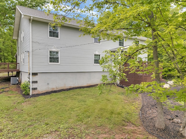 6525 Idumea Rd, Corryton, TN 37721 - view of home's exterior with a deck, a lawn, central AC unit, and roof with shingles