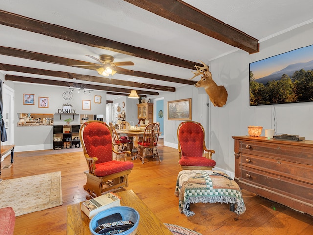 6525 Idumea Rd, Corryton, TN 37721 - living room featuring wood-type flooring, beamed ceiling, a ceiling fan, and baseboards