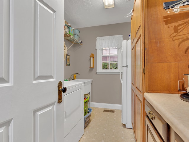 6525 Idumea Rd, Corryton, TN 37721 - washroom with washer / clothes dryer, baseboards, and light tile patterned floors