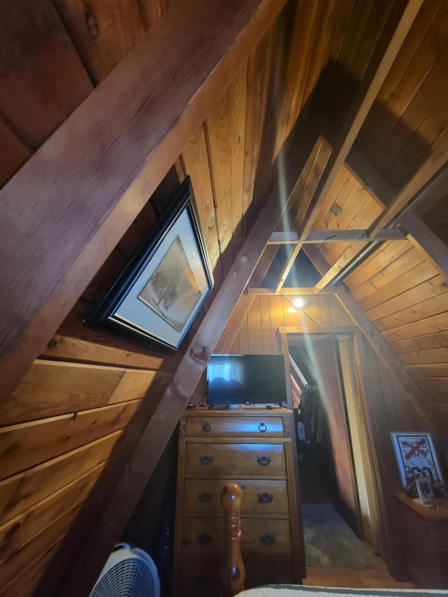 bonus room featuring wood ceiling, vaulted ceiling, and wood walls