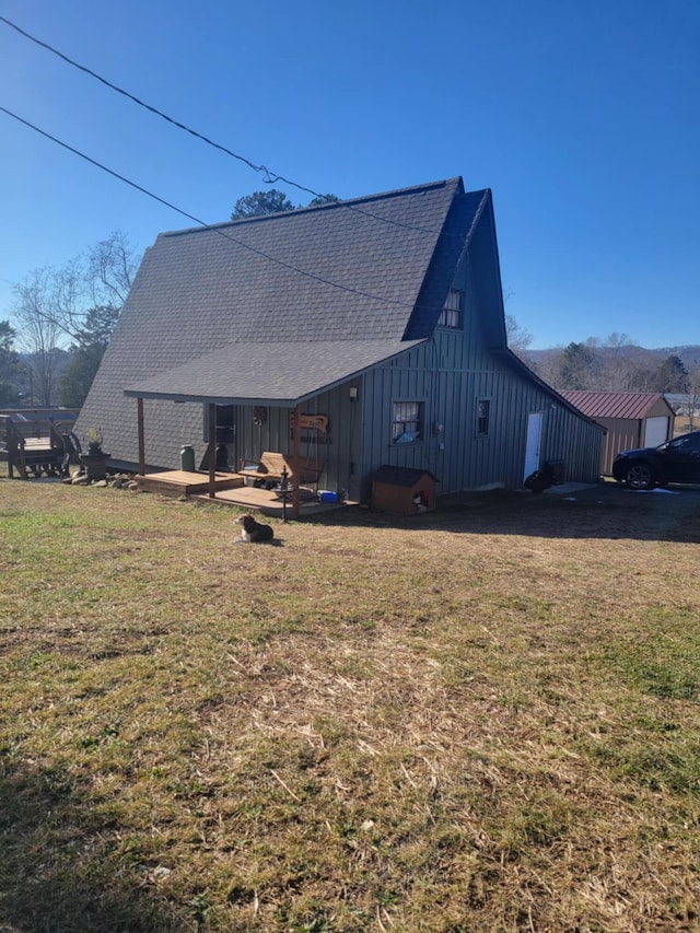 back of house with a lawn and a patio