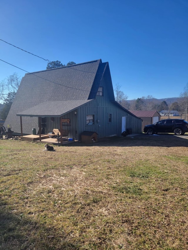 view of side of home featuring a yard