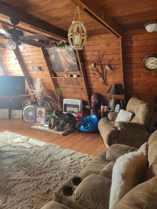 living room featuring heating unit, wood walls, wood-type flooring, wood ceiling, and beam ceiling