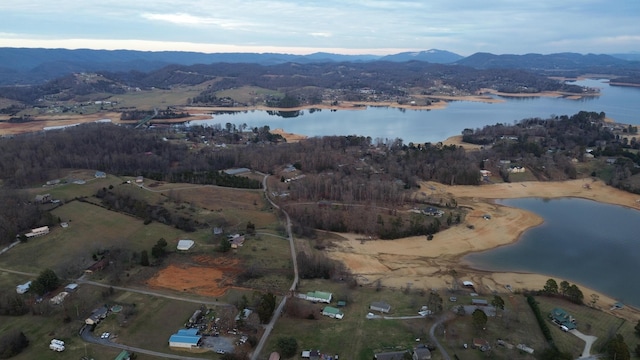 aerial view featuring a water and mountain view