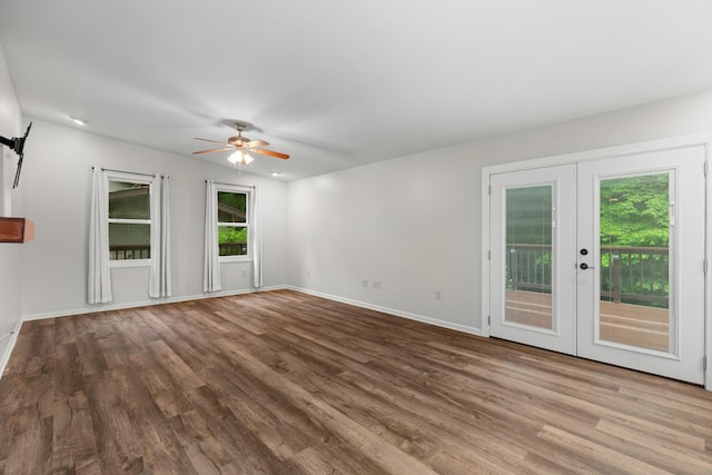 2935 Glendale Community Rd, Greenback, TN 37742 - unfurnished living room with french doors, wood finished floors, and baseboards