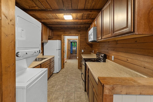 2935 Glendale Community Rd, Greenback, TN 37742 - kitchen with white appliances, wood ceiling, stacked washer / drying machine, wood walls, and light countertops