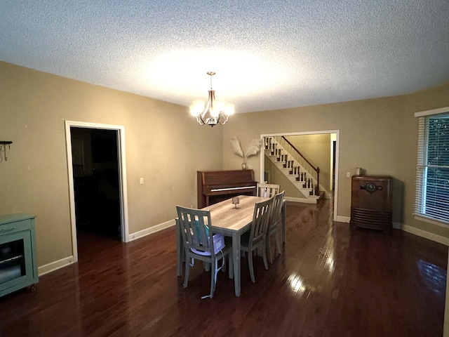 dining area with an inviting chandelier, stairs, baseboards, and wood finished floors