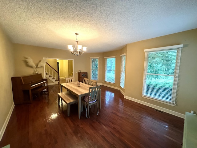 dining space with a chandelier, dark wood-style flooring, visible vents, baseboards, and stairway