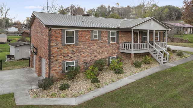 view of front facade with a porch and a garage