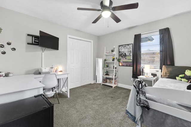 bedroom featuring a closet, dark carpet, and ceiling fan