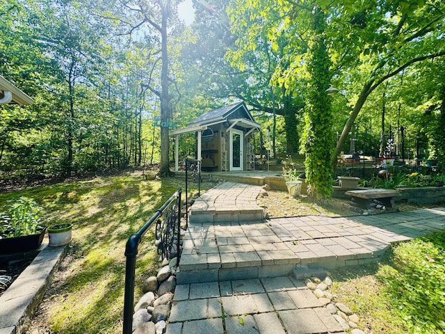 view of home's community with an outdoor structure