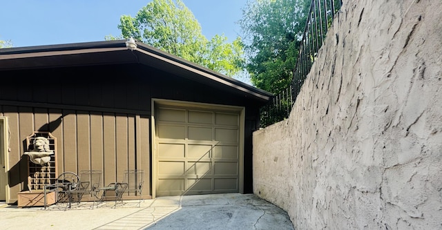garage with concrete driveway