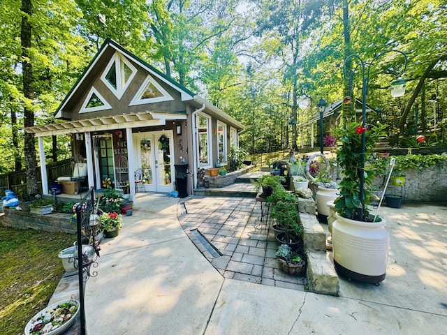view of patio / terrace with french doors and fence