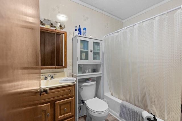 full bathroom with toilet, ornamental molding, vanity, and shower / bath combo with shower curtain