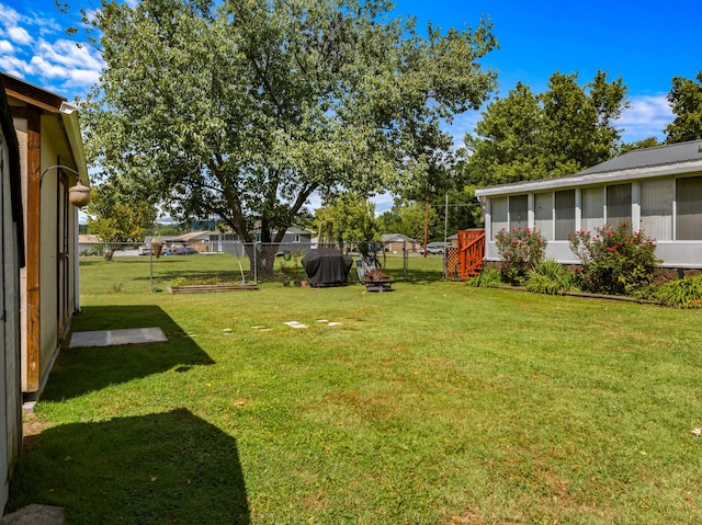 view of yard with a sunroom