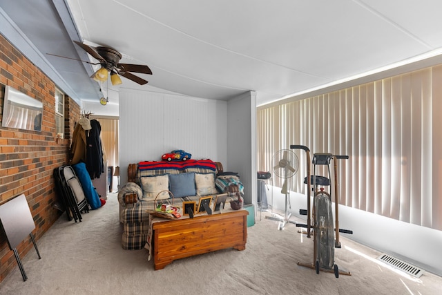 interior space featuring ceiling fan and light colored carpet