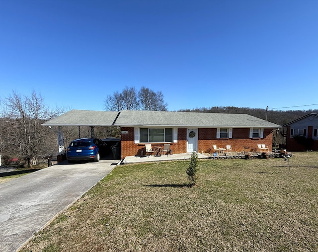 single story home with a carport and a front yard