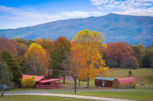 mountain view featuring a rural view