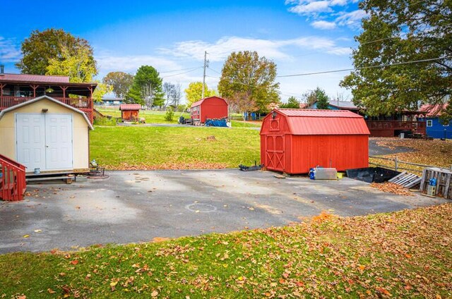 view of patio featuring a storage unit