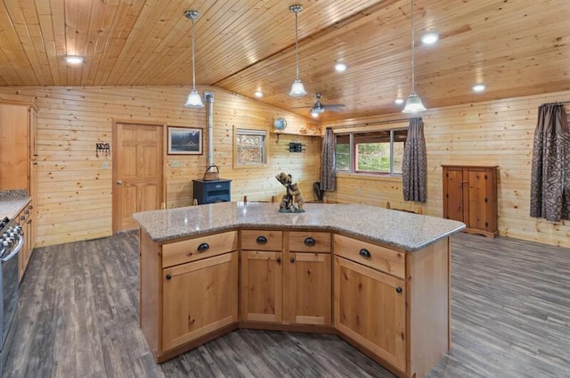 kitchen with decorative light fixtures, a center island, lofted ceiling, and dark wood-type flooring